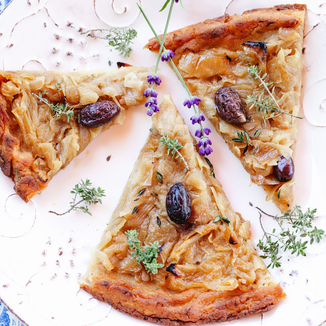 Pissaladiere recipe. Traditional Provencal sweet onion pizza made with sweet onions confit in extra virgin olive oil. Exclusive recipe of Chateau de Luz.